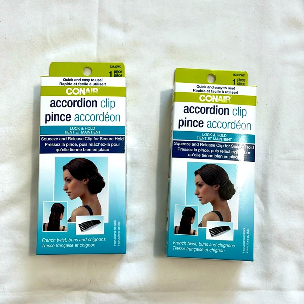 Two pieces of Conair brand accordion hair clips.